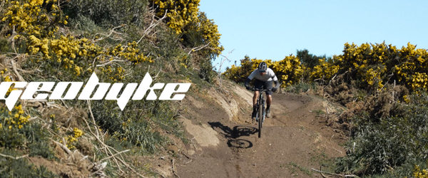 Rider on a GeoByke e-bike descending a rugged Bluff Hill mountain bike trail in Southland